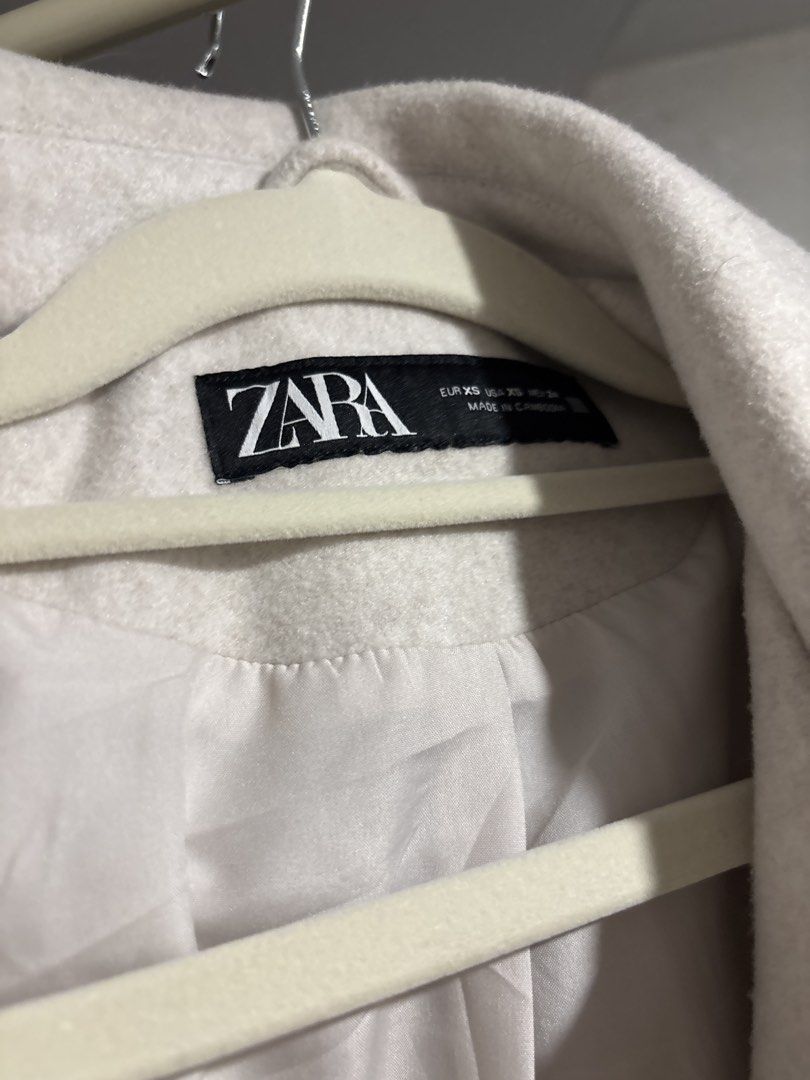 Zara Off-White Wool Blend Cropped Shacket XS (Category: Coats, Jackets and Outerwear) located in Tarlac. Submitted by somethinboutgyu (Listing ID 1470671952, Image 2). Description: - Brand: Zara - Color: Off-white - Size: XS - Material: 100% polyester (fully lined) - Closure: Front button with silver-tone snap buttons - Pockets: Two chest pockets with flaps - Collar: Classic lapel - Condition: Great transitional piece for casual outfits.
