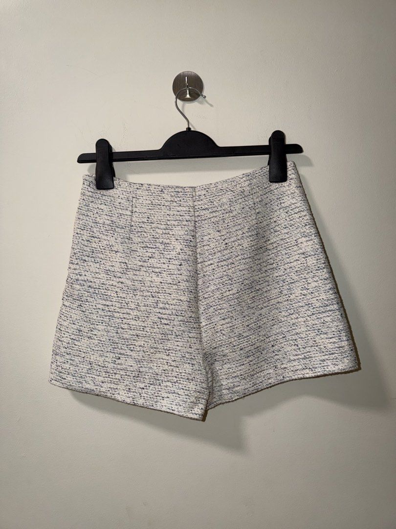 Zara Tweed Skort White Blue Size M (Category: Shorts) located in Makati City. Submitted by andzr. (Listing ID 1470643199, Image 3). Description: - Brand: Zara - Style: Tweed skort with stylish blue specks - Size: M - Fit: High-waisted - Details: Textured fabric, side zip closure - Condition: Clean all around, well-maintained.
