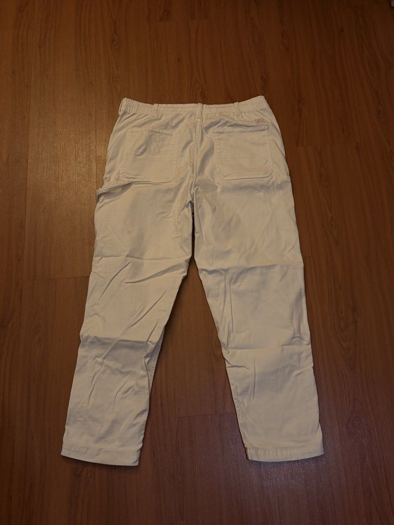 Zara White Carpenter Pants Size L (Category: Jeans) located in Manila. Submitted by preloved123. (Listing ID 1470717397, Image 2). Description: - Brand: Zara - Style: White carpenter pants with utility pockets and hammer loop - Fit: Relaxed fit with elastic waistband in the back, button closure, and zip fly - Material: Thick, durable cotton - Origin: Made in Bangladesh - Size: EUR L / USA L / MEX 32 - Condition: Great streetwear staple for everyd