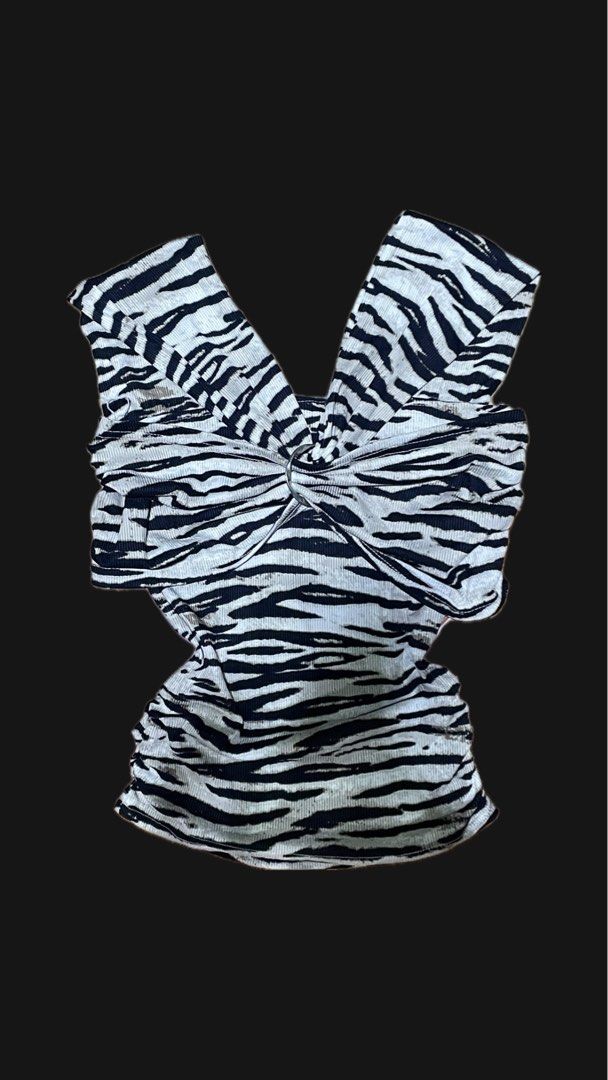 zebra print off-shoulder top (Category: Others Tops) located in Taguig. Submitted by chichoneyy (Listing ID 1470654065, Image 1). Description: black-and-white zebra print top with an off-the-shoulder neckline, short sleeves, and a twisted draped bust detail with a flattering V-neck strap design. ♡ stylish and easy to pair with skirts, jeans, or shorts ♡ perfect for casual fits and going-out looks ♡ reference: xs, but GOOD for both for s-xs sized 