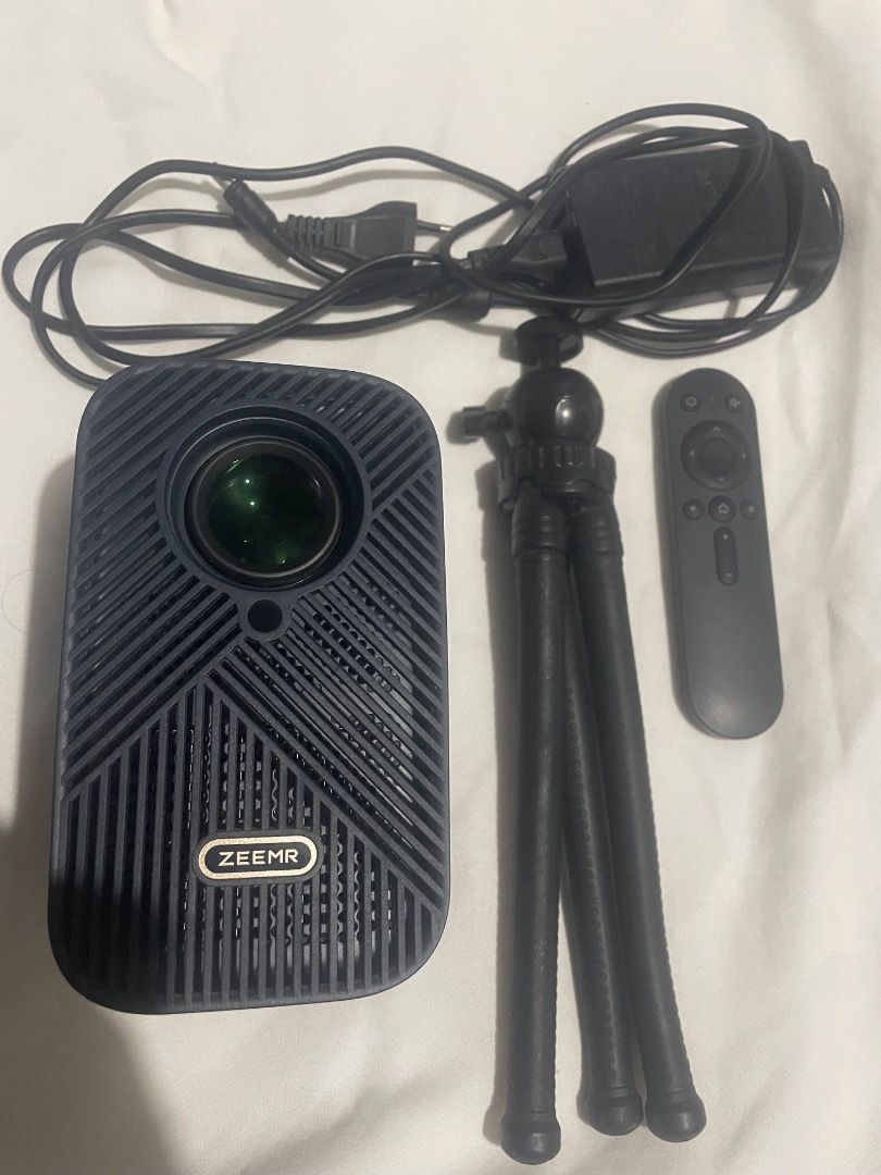 ZEEMR M1 Pro Smart Mini Projector (Category: Media Streamers & Hubs) located in Tarlac. Submitted by arcbri17 (Listing ID 1470725767, Image 1). Description: ZEEMR M1 Pro Smart Mini Projector for sale. Used but in good condition. Comes with remote control and power adapter as shown in the photos. Features: • Smart projector with Android OS • Wi-Fi connectivity • HDMI & USB ports • Built-in speaker • Supports 4K decoding / HDR10 • Up to 120” projec