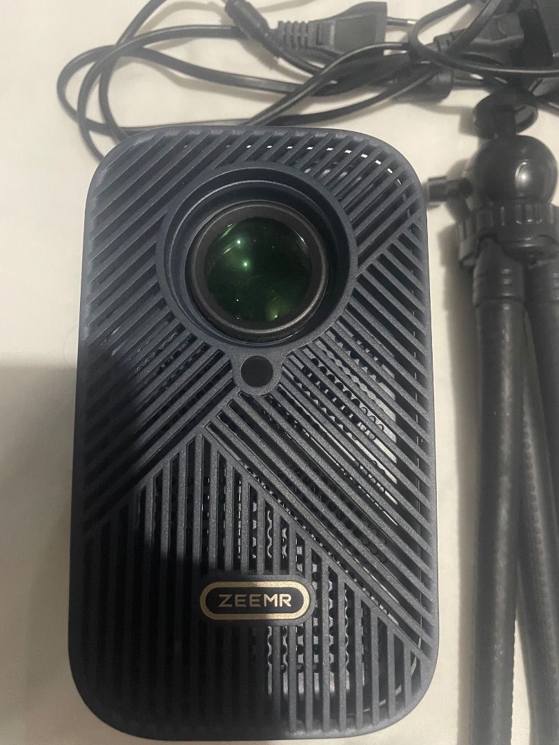 ZEEMR M1 Pro Smart Mini Projector (Category: Media Streamers & Hubs) located in Tarlac. Submitted by arcbri17 (Listing ID 1470725767, Image 2). Description: ZEEMR M1 Pro Smart Mini Projector for sale. Used but in good condition. Comes with remote control and power adapter as shown in the photos. Features: • Smart projector with Android OS • Wi-Fi connectivity • HDMI & USB ports • Built-in speaker • Supports 4K decoding / HDR10 • Up to 120” projec