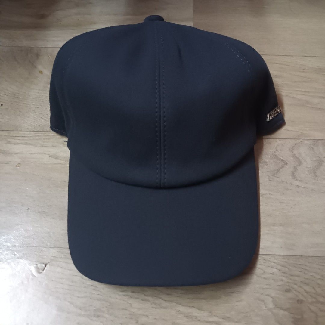 Zegna Zephyr Suede Cap (Category: Caps & Hats) located in Manila. Submitted by itsnik444 (Listing ID 1470637498, Image 1). Description: - Brand: Ermenegildo Zegna (Zephyr Line) - Color: Dark blue exterior with grey lining and orange sweatband piping - Details: Metallic Zegna logo badge on the side panel - Fit: Elasticated back strap for an adjustable fit - Condition: Clean inside and out, premium luxury headwear.
