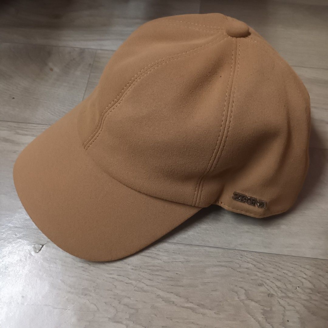 Zegna Zephyr Tan Suede Baseball Cap (Category: Caps & Hats) located in Manila. Submitted by itsnik444 (Listing ID 1470603815, Image 1). Description: - Brand: Zegna Zephyr - Material: Premium tan suede with grey inner lining and brown band - Details: Metal Zegna logo plaque on the side panel - Design: Clean shape, curved brim - Condition: Excellent, well-maintained - Style: Versatile neutral tone, great for casual everyday wear.