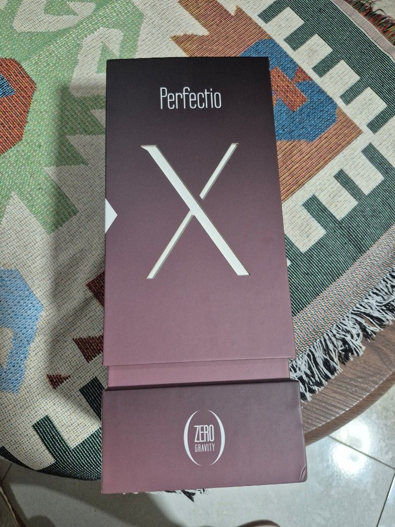 Zero Gravity Perfectio X Facial Device Box SKU PERFECTIOX100 (Category: Face Care) located in Baguio. Submitted by lightcollection (Listing ID 1470691212, Image 1). Description: - Preloved Zero Gravity Perfectio X therapeutic beauty device - FDA Class II medical device utilizing advanced LED infrared light and heat therapy - Designed by Zero Gravity in the USA - Includes PerfectioX device, plug adapter, instruction manual, and travel bag - Barcod
