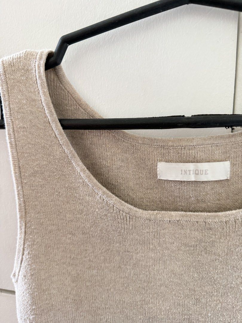 100% Cotton Knit Tank Top Beige (Category: Sleeveless) located in Manila. Submitted by mnlclaudia (Listing ID 1470790750, Image 2). Description: - Brand: INTIQUE - Material: 100% Cotton - Color: Neutral beige - Design: Scoop neck, sleeveless, soft ribbed knit texture - Style: Versatile basic, perfect for pairing with jeans or skirts - Condition: Brand new / Excellent.