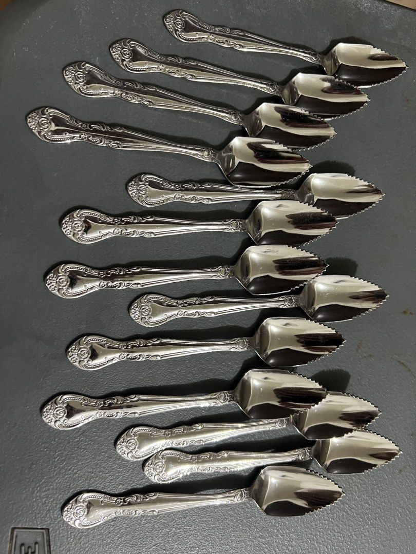 13pcs serrated fruit/grapefruit spoons (Category: Dinnerware & Cutlery) located in Manila. Submitted by ajd080324 (Listing ID 1470774158, Image 1). Description: Selling a rare, matching 13-piece set of authentic vintage serrated fruit/citrus spoons. Stamped “Stainless Steel Made in Japan” on the back. Features a beautiful, detailed ornate rose and scroll baroque handle pattern..