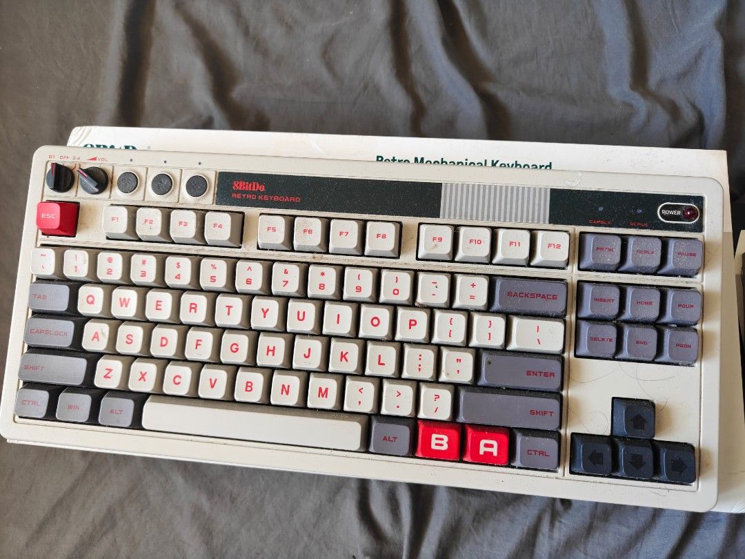 8BitDo Retro Mechanical Keyboard and Retro N30 Mouse (Category: Computer Keyboard) located in Tarlac. Submitted by raphocehcap (Listing ID 1469050906, Image 1). Description: - 8BitDo Retro Mechanical Keyboard and matching R8 Mouse - Condition: Like new, unboxed with original packaging included - Design: Classic retro aesthetic in grey and beige with striking red accents - Connectivity: Tri-mode wireless (2.4G, Bluetooth, and wired USB) - Perfect 