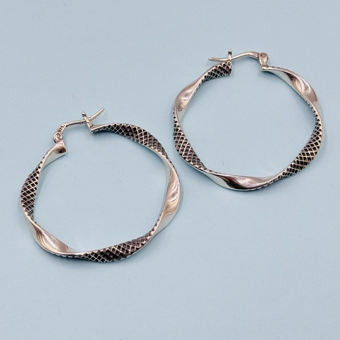 925 Silver Textured Twist Hoop Earrings (Category: Earrings) located in Baguio. Submitted by paatttyyyy (Listing ID 1470910396, Image 1). Description: - Material: Solid 925 sterling silver with official hallmark stamp - Design: Twisted hoop with a detailed textured scale pattern - Closure: Secure clasp for comfortable, all-day wear - Finish: Clean and polished for a brilliant shine - Condition: Brand new, ready to ship or meet up!.