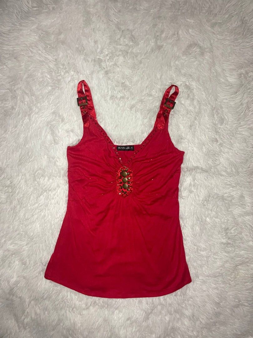 ✨ Vintage Nova Girl Studded Cami ✨ (Category: Sleeveless) located in Tambulig. Submitted by vestraarchives. (Listing ID 1470807489, Image 1). Description: This vintage Nova Girl studded hardware camisole serves the ultimate mid-2000s cyber grunge aesthetic. Crafted from a vibrant cherry-red stretch fabric, this top blends edgy hardware accents with classic Y2K textures for a standout, nostalgic look..