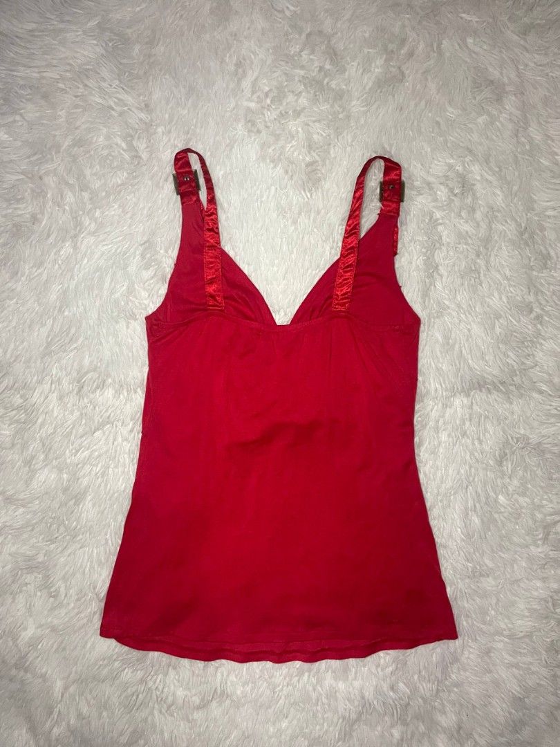 ✨ Vintage Nova Girl Studded Cami ✨ (Category: Sleeveless) located in Tambulig. Submitted by vestraarchives. (Listing ID 1470807489, Image 2). Description: This vintage Nova Girl studded hardware camisole serves the ultimate mid-2000s cyber grunge aesthetic. Crafted from a vibrant cherry-red stretch fabric, this top blends edgy hardware accents with classic Y2K textures for a standout, nostalgic look..