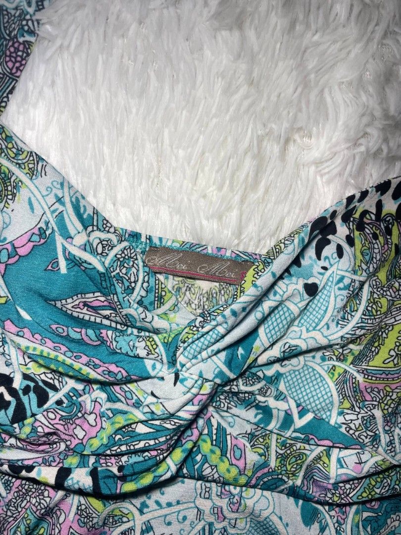 ✨ Vintage Paisley Halter Top ✨ (Category: Sleeveless) located in Tambulig. Submitted by vestraarchives. (Listing ID 1470807917, Image 3). Description: Super rare early 2000s / Y2K beach party aesthetic! 🌊🍹 Featuring a chaotic, vibrant mix of teal paisley, animal print accents, and neon floral details, this multi-patterned beauty is the ultimate sun-drenched throwback staple..