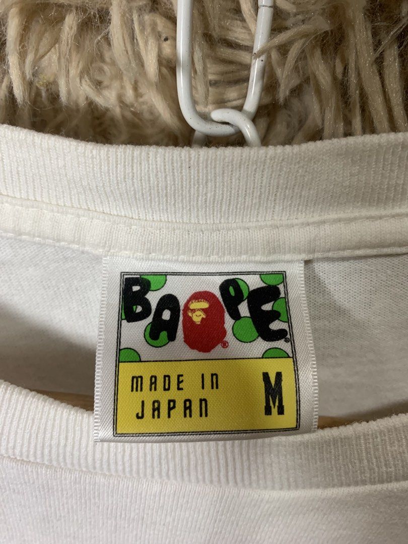 A Bathing Ape Ape Shall Never Kill Ape T-Shirt (Category: Tshirts & Polo Shirts ) located in Cotabato. Submitted by clarence0918 (Listing ID 1470857495, Image 3). Description: Bà Pé(authentic legit) Size medium on tag 20.5x26 Very Good condition 9.8/10 Color rate Pinhole sa hem and minimal hairlines.