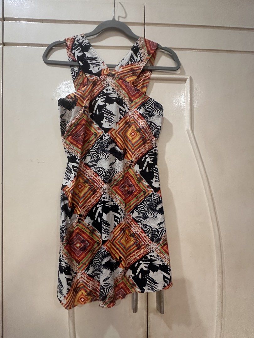 Abstract Geometric Print Halter Neck Dress (Category: Dresses) located in Las Pinas. Submitted by novaglow (Listing ID 1470787706, Image 1). Description: - Design: Geometric diamond patterns mixed with abstract black and white waves - Neckline: Halter style with stylish crossed straps - Cut: Short, sleeveless, falls around mid-thigh - Fabric: Smooth and comfortable feel - Versatility: Great casual piece for warm weather or going out.