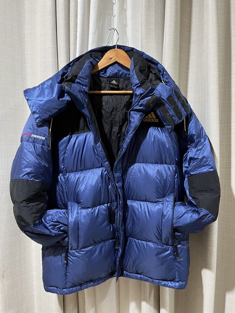 Adidas Blue Black Down Puffer Jacket 800 Size 110 (26” x 28”) (Category: Coats, Jackets and Outerwear) located in Tarlac. Submitted by thriftygoodss (Listing ID 1470928360, Image 3). Description: - Brand: Adidas - Colorway: Blue, black, with yellow, red, and white accents - Material: Premium warm down insulation - Features: Hooded with yellow drawstrings, full front zip, and dual zip pockets - Embroidery details: Yellow Adidas logo on chest, "HIK