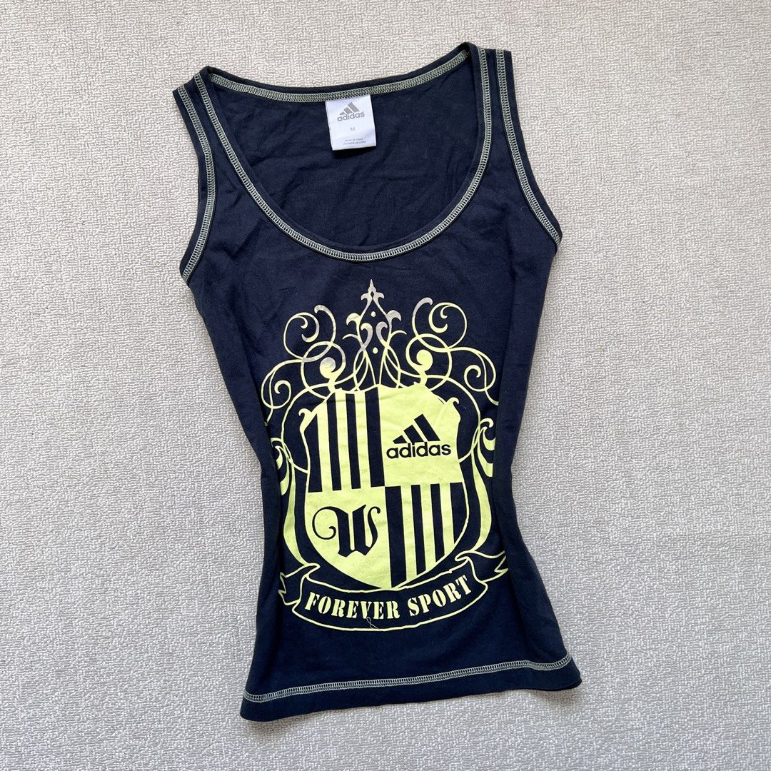 adidas forever sport tank top (Category: Sleeveless) located in Limay. Submitted by budolfindsrawrawr (Listing ID 1470752401, Image 2). Description: adid4s forever sport tank top - m on tag l22 b36 - vintage dated 03/06 - some black ink to its print.