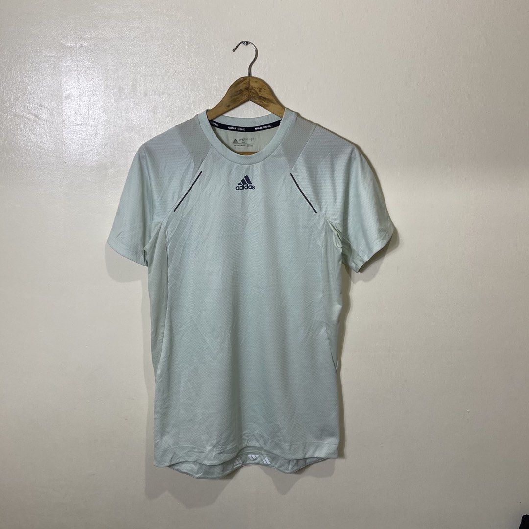 Adidas HIIT Spin Tee Mint Green Size S (Category: Activewear) located in Manila. Submitted by carbertjakosalem (Listing ID 1470920877, Image 1). Description: - Brand: Adidas HIIT Spin Tee - Color: Mint Green - Size: Small (Regular Fit) - Material: Recycled polyester and elastane blend - Features: Breathable mesh panels, lightweight fabric, and Techfit construction - Eco-Friendly: End Plastic Waste branding on the inside collar - Condition: Clean 