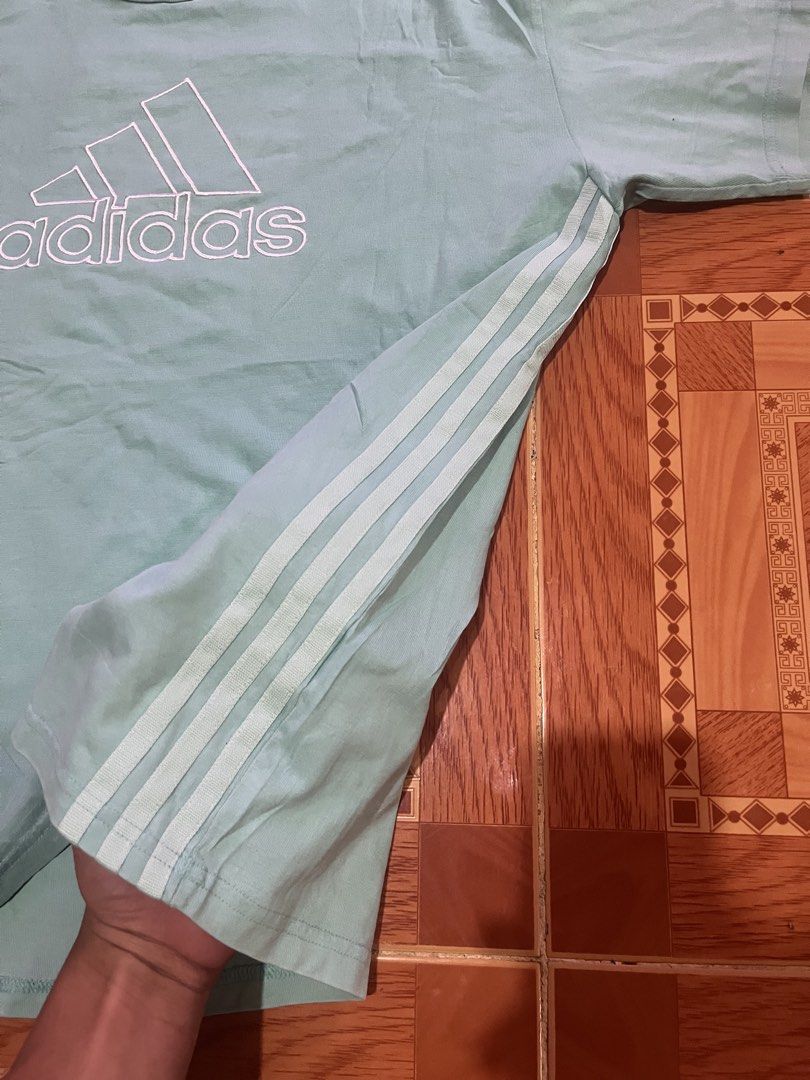 Adidas light blue t-shirt with logo (Category: Tshirts & Polo Shirts ) located in Kidapawan. Submitted by azythrift (Listing ID 1470821795, Image 3). Description: - Brand: Adidas - Color: Light Blue - Size: Large - Design: Large outlined Trefoil logo on chest & classic three stripes on sleeves - Details: Ribbed crew neck, 'I AM SPORT' inner collar tag - Material: Comfortable, breathable cotton.