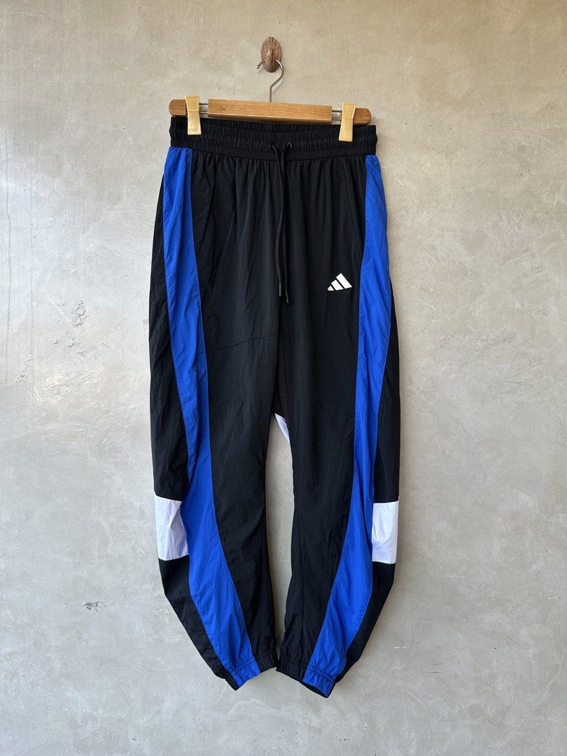 ADIDAS Logo Woven Track Pants (Category: Trousers) located in Cavite. Submitted by second_story_ph (Listing ID 1470834831, Image 3). Description: ADIDAS Logo Woven Track Pants Size: Medium 15” Waistline stretchable 40” Length Condition: Like New.