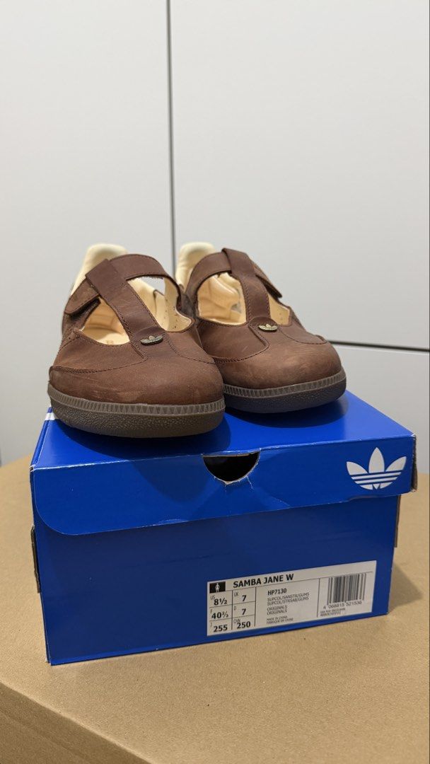 Adidas Samba Jane W Brown Size US 8.5 (Category: Sneakers) located in Manila. Submitted by pamchii (Listing ID 1470745657, Image 1). Description: - Model: Brown Adidas Samba Jane W (Mary Jane style with T-strap) - Size: US 8.5 / UK 7 / EU 40 2/3 - Material: Clean suede leather upper with gum sole - Details: Metallic trefoil logo on the strap - Inclusions: Original blue Adidas shoebox - Condition: Like new. But I once wore dark socks and the color