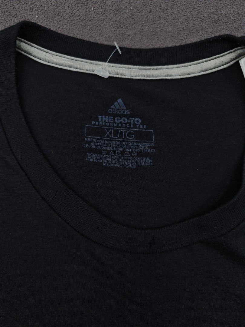 Adidas The Go-To Performance Tee Black XL (Category: Tshirts & Polo Shirts ) located in Bulacan. Submitted by pzj_thrift (Listing ID 1470778918, Image 2). Description: condition 9/10 color rate 9/10 no issue.