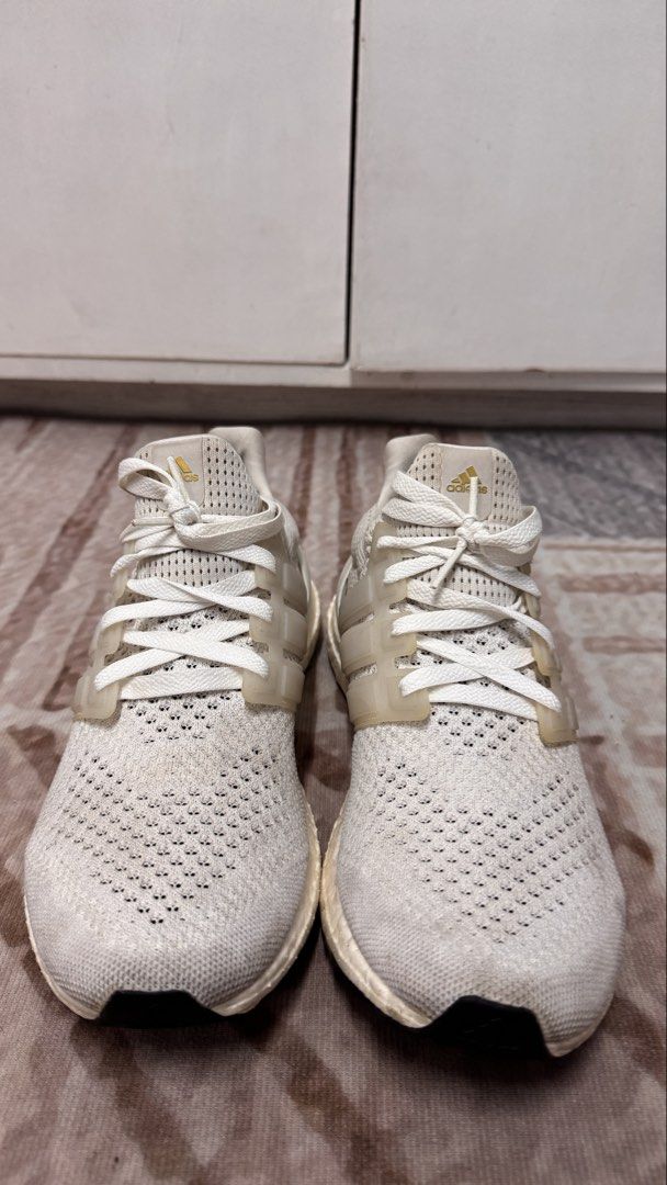 Adidas Ultraboost – White | US 10 (Category: Sneakers) located in Manila. Submitted by mbandrada18 (Listing ID 1470825797, Image 2). Description: Adidas Ultraboost – White | US 10 Selling my pre-loved Adidas Ultraboost in a neutral white and cream colorway. A versatile option for everyday wear, walking, and casual styling. Details: • Size: US 10 • Colorway: White • No sole separation • Pre-loved condition; please see photos for actual condition �