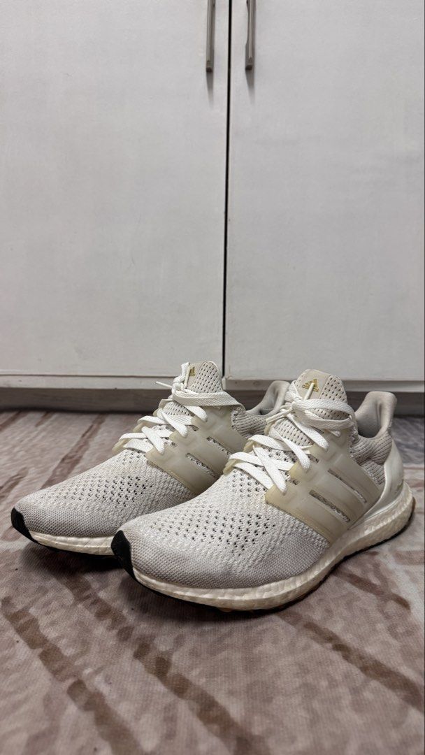 Adidas Ultraboost – White | US 10 (Category: Sneakers) located in Manila. Submitted by mbandrada18 (Listing ID 1470825797, Image 1). Description: Adidas Ultraboost – White | US 10 Selling my pre-loved Adidas Ultraboost in a neutral white and cream colorway. A versatile option for everyday wear, walking, and casual styling. Details: • Size: US 10 • Colorway: White • No sole separation • Pre-loved condition; please see photos for actual condition �