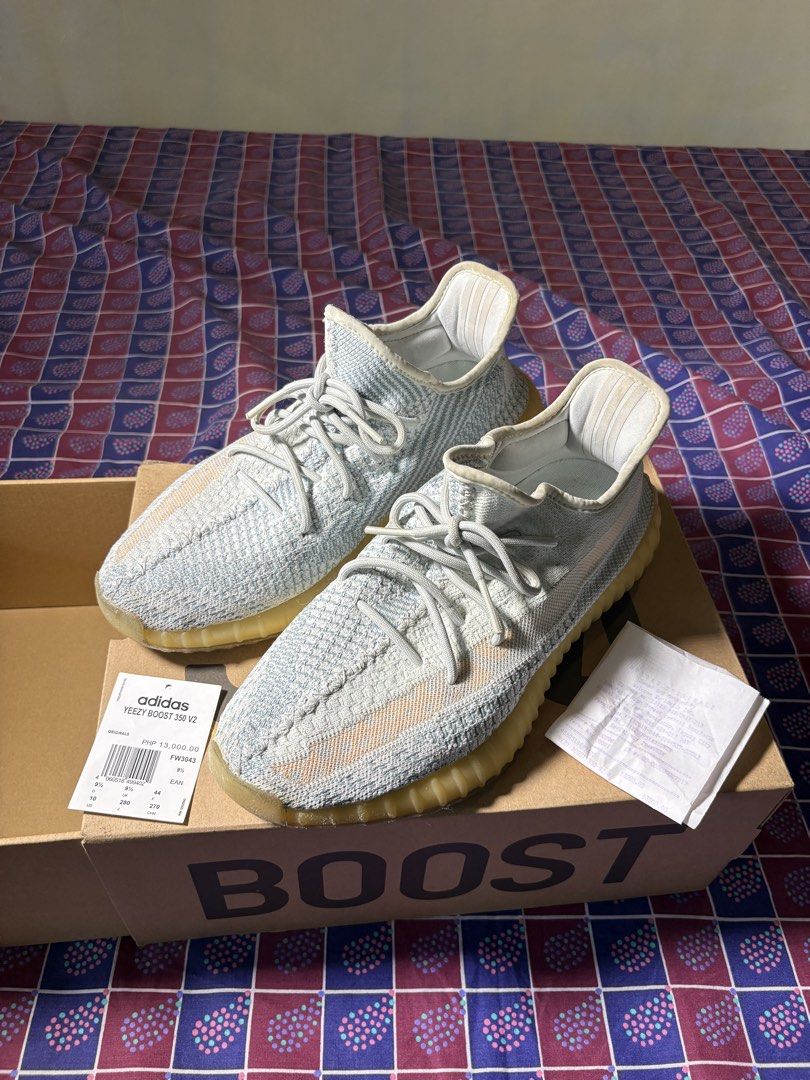 Adidas Yeezy Boost 350 V2 Cloud White size US 10 (Category: Sneakers) located in Manila. Submitted by dailystuff.ph (Listing ID 1470755753, Image 3). Description: - Model: Adidas Yeezy Boost 350 V2 Cloud White - Size: US 10 / UK 9.5 / EU 44 - Condition: Lightly worn, clean insoles and soles (has sole protect since bought until now), slight midsole yellowing - Features: Primeknit upper and translucent gum sole - Inclusions: Original box, store tag