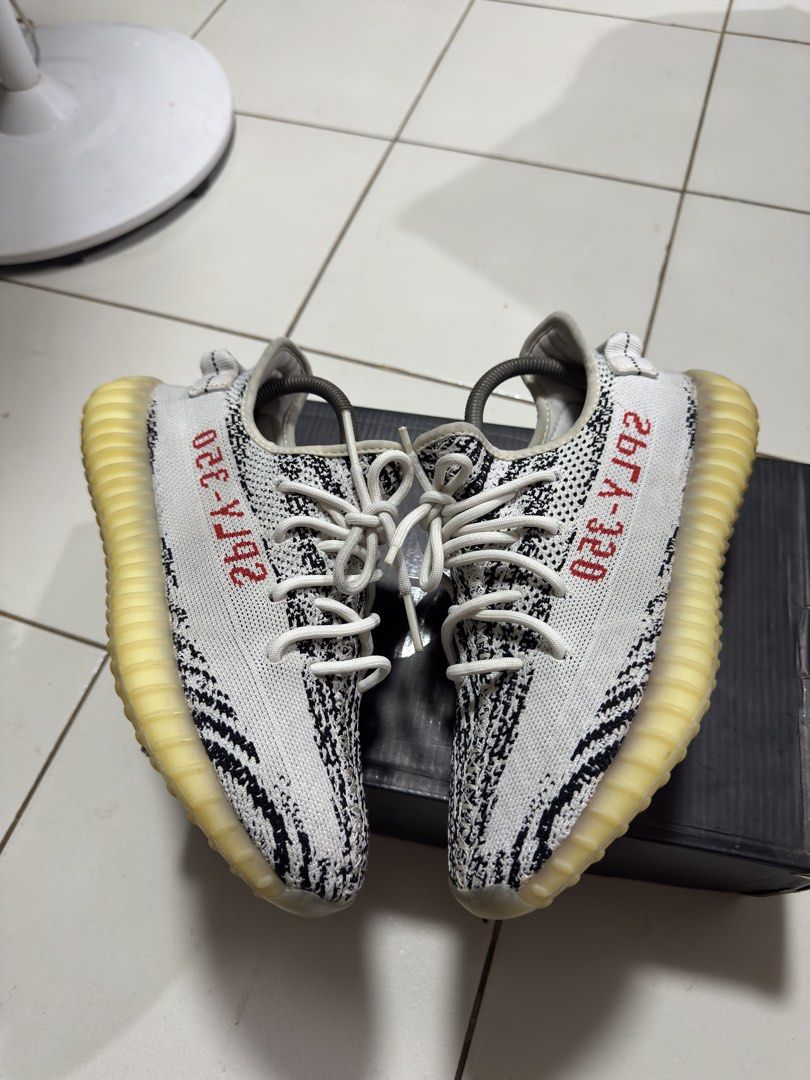 Adidas Yeezy Boost 350 V2 Zebra (Category: Sneakers) located in Manila. Submitted by mislangers_stuff (Listing ID 1470852619, Image 3). Description: - Item: Adidas Yeezy Boost 350 V2 (Zebra) - Condition: Worn a few times, very clean uppers - Note: Translucent midsole shows natural yellowing over time - Inclusions: White laces, shoe trees included, and original black box - Meet-ups and shipping available across PH.