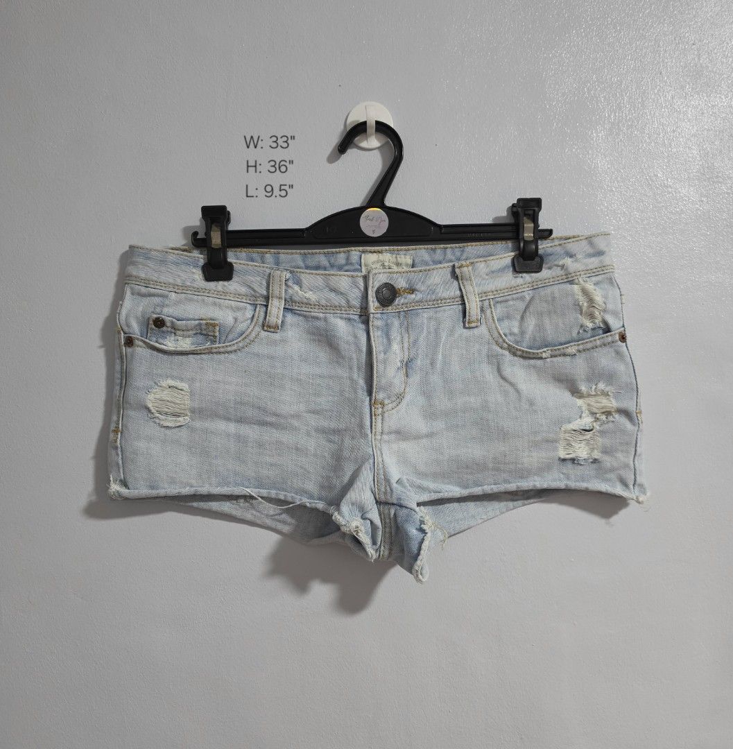 Aeropostale Distressed Light Wash Denim micro Shorts (Category: Shorts) located in Paranaque City. Submitted by franinnashop (Listing ID 1470849465, Image 1). Description: Declutter - Brand: Aeropostale - Style: Light wash denim low waist shorts with edgy distressed details on front/back pockets and a raw hem - Features: Secure button closure and convenient belt loops - Measurements (laid flat): Waist 33 inches | Length 9.5 inches - Condition: Ex