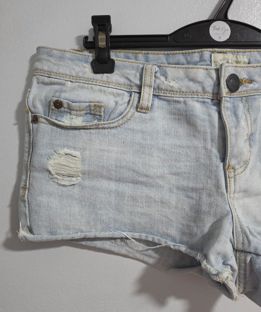 Aeropostale Distressed Light Wash Denim micro Shorts (Category: Shorts) located in Paranaque City. Submitted by franinnashop (Listing ID 1470849465, Image 3). Description: Declutter - Brand: Aeropostale - Style: Light wash denim low waist shorts with edgy distressed details on front/back pockets and a raw hem - Features: Secure button closure and convenient belt loops - Measurements (laid flat): Waist 33 inches | Length 9.5 inches - Condition: Ex