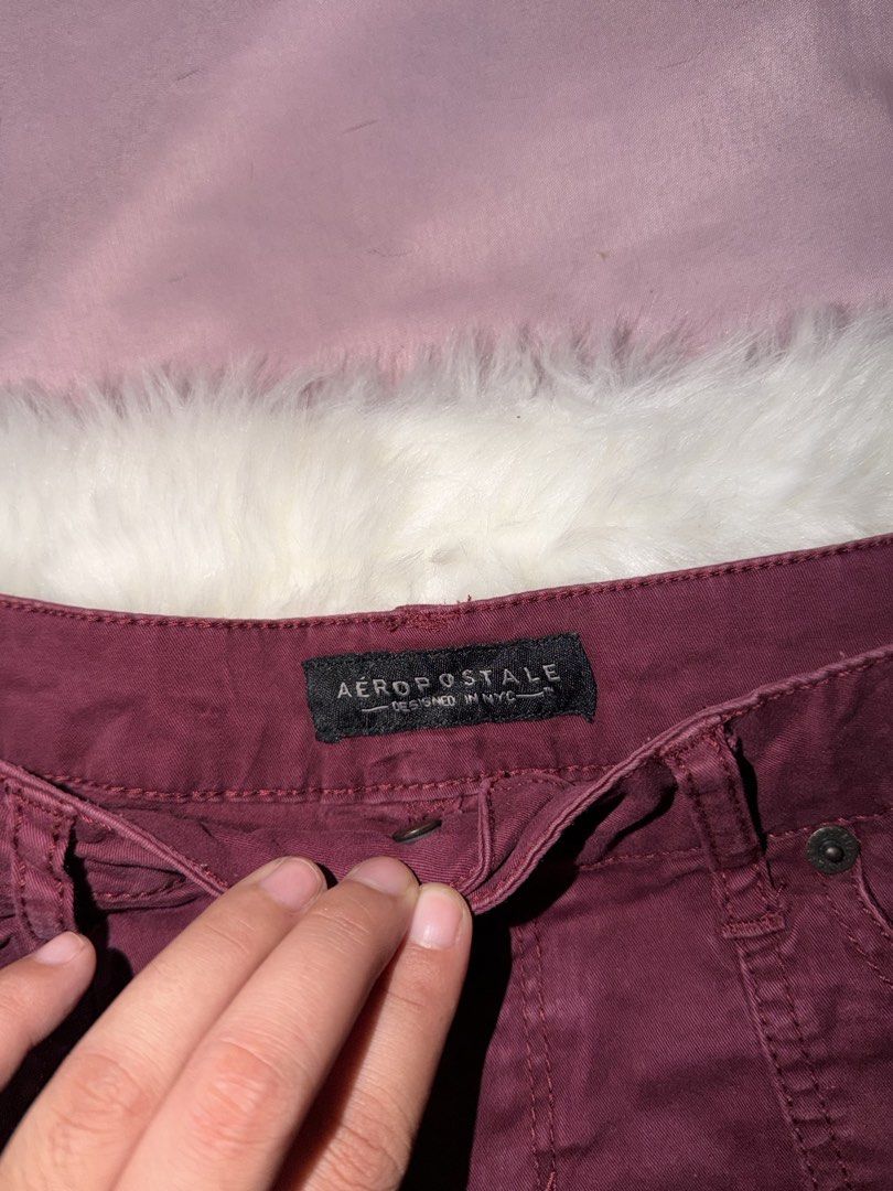 Aeropostale Maroon Cargo Denim Shorts (Category: Shorts) located in Manila. Submitted by maureenn10 (Listing ID 1470841770, Image 3). Description: - Brand: Aéropostale - Color: Maroon - Style: Mid-rise denim shorts with raw hem edges - Pockets: Multiple functional button-flap pockets on front and back - Details: Leather brand patch on back waistband - Closure: Zip fly with metal button - Condition: Excellent / Ready to wear - Perfect for casual O