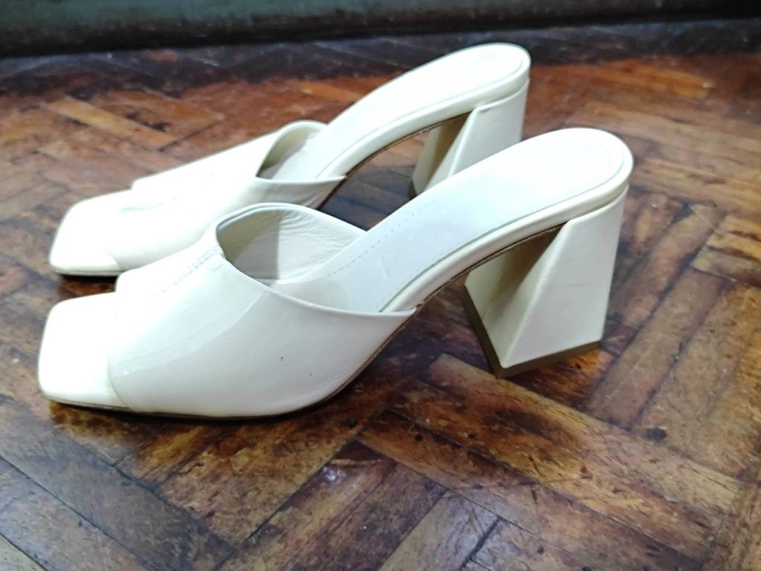 Aeyde Cream Mules Block Heels Square Toe (Category: Heels) located in Bacoor. Submitted by stargazer1084 (Listing ID 1470836514, Image 3). Description: - Brand: Aeyde - Style: Cream mules / slip-on heels - Design: Square toe with wide upper strap and chunky block heel - Details: Debossed logo on insole - Condition: Minimal wear on the soles, well-maintained - Color: Versatile clean neutral shade.