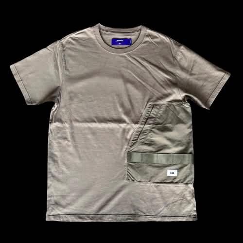 Aftermaths tee (Category: Tshirts & Polo Shirts ) located in Caloocan City. Submitted by landcruiser76__ (Listing ID 1470874134, Image 1). Description: - Brand: Aftermaths - Color: Taupe / Khaki with purple interior neck tag - Size: Medium - Material: Heavyweight cotton with clean construction - Design: Tactical utility chest pocket wrapping around to the back - Details: Features strap webbing and a small logo patch - Cut: Crew neck, short sleeve