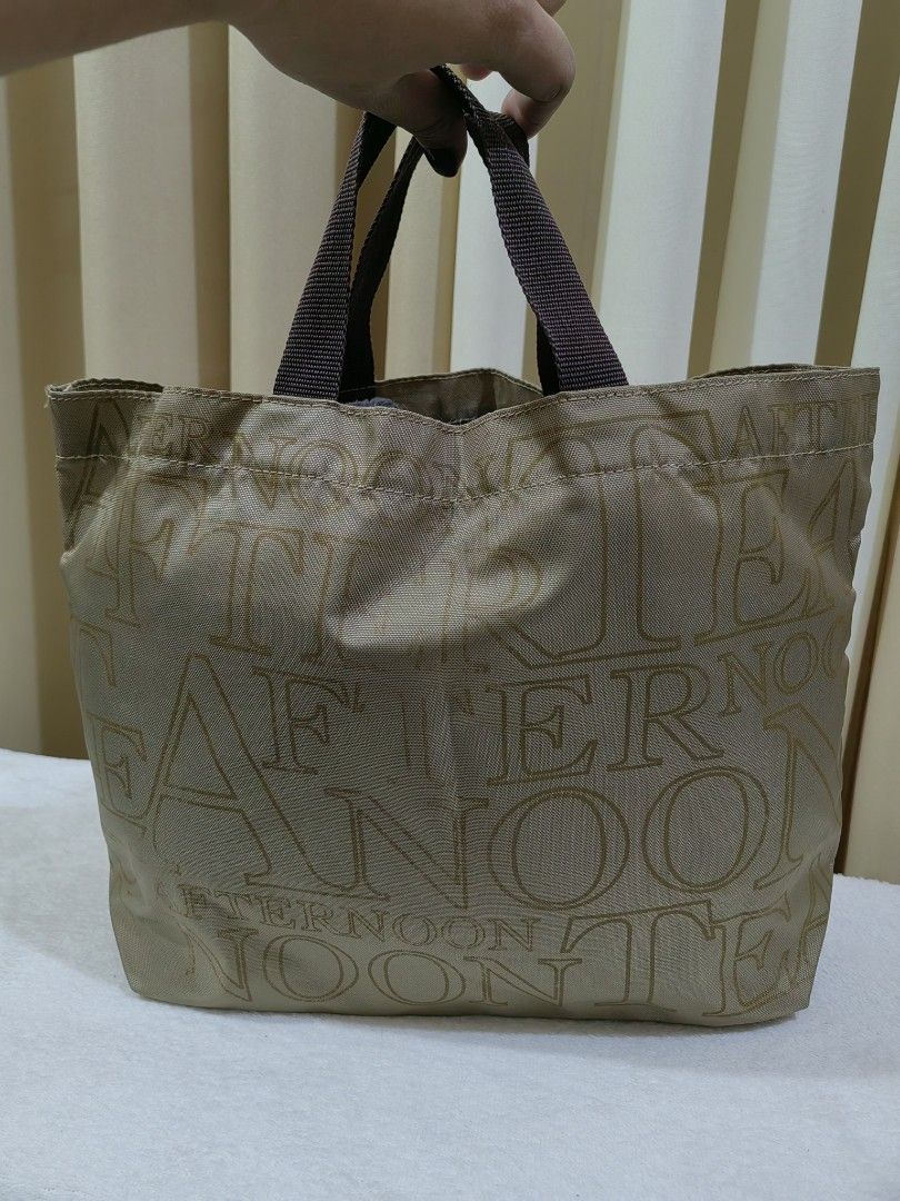 Afternoon tea Hand Bag (Category: Tote Bags) located in Makati City. Submitted by prelovedtreatedwithlove (Listing ID 1470894694, Image 2). Description: - Color: Beige with brown fabric handles - Spacious, medium size - Material: Durable fabric, ideal for everyday use - Condition: Clean inside and out, ready to ship.