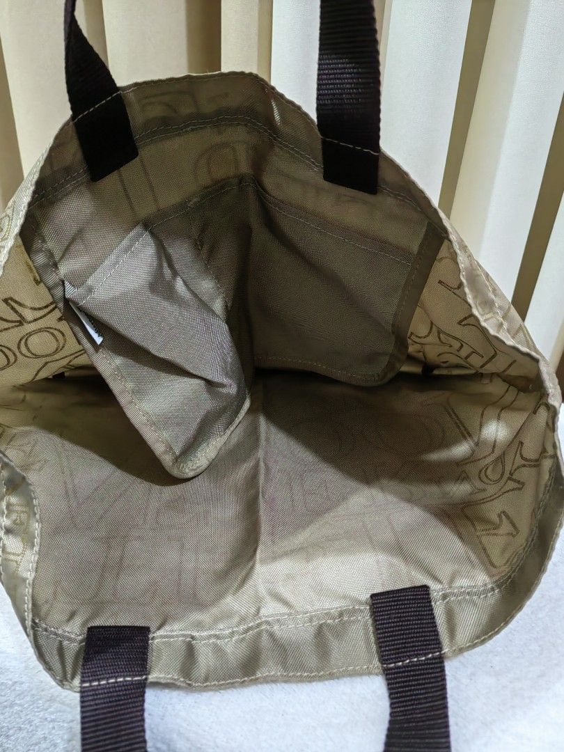 Afternoon tea Hand Bag (Category: Tote Bags) located in Makati City. Submitted by prelovedtreatedwithlove (Listing ID 1470894694, Image 3). Description: - Color: Beige with brown fabric handles - Spacious, medium size - Material: Durable fabric, ideal for everyday use - Condition: Clean inside and out, ready to ship.