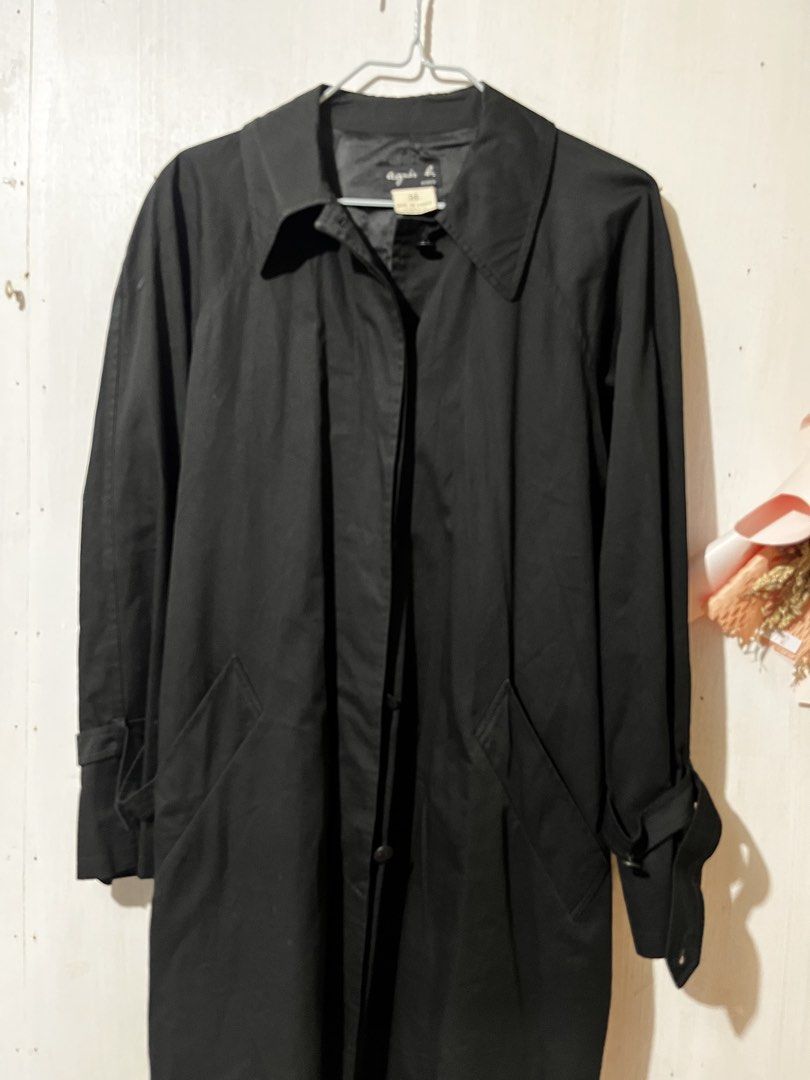 Agnes b. Black Trench Coat Size 36 (Category: Coats, Jackets and Outerwear) located in Balanga. Submitted by clscloset.621 (Listing ID 1470754819, Image 1). Description: - Brand: Agnes b. Paris - Size: 36 - Color: Classic black - Design: Button front closure, structured collar, and clean back vent - Details: Long sleeves with buckle straps at the cuffs, deep front pockets - Lining: Fully lined with subtle logo embroidery throughout - Condition/St