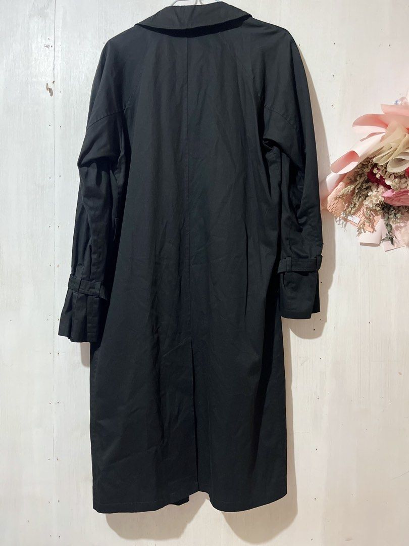 Agnes b. Black Trench Coat Size 36 (Category: Coats, Jackets and Outerwear) located in Balanga. Submitted by clscloset.621 (Listing ID 1470754819, Image 2). Description: - Brand: Agnes b. Paris - Size: 36 - Color: Classic black - Design: Button front closure, structured collar, and clean back vent - Details: Long sleeves with buckle straps at the cuffs, deep front pockets - Lining: Fully lined with subtle logo embroidery throughout - Condition/St