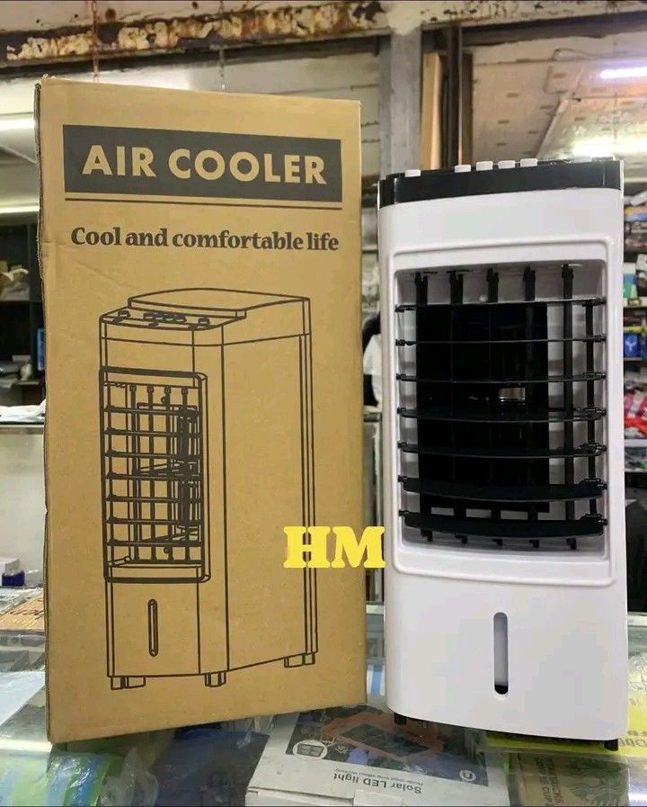 Air Cooler with Ice Pack Bottles and Box (Category: Air Conditioning and Heating) located in Quezon City. Submitted by marecel146 (Listing ID 1470746544, Image 2). Description: - Stylish white and black tower air cooler for beat-the-heat comfort - Adjustable front louvers for targeted airflow - Convenient push-button top controls and front water level window - Includes 6 blue rectangular ice packs for extra cooling power - Comes with its original