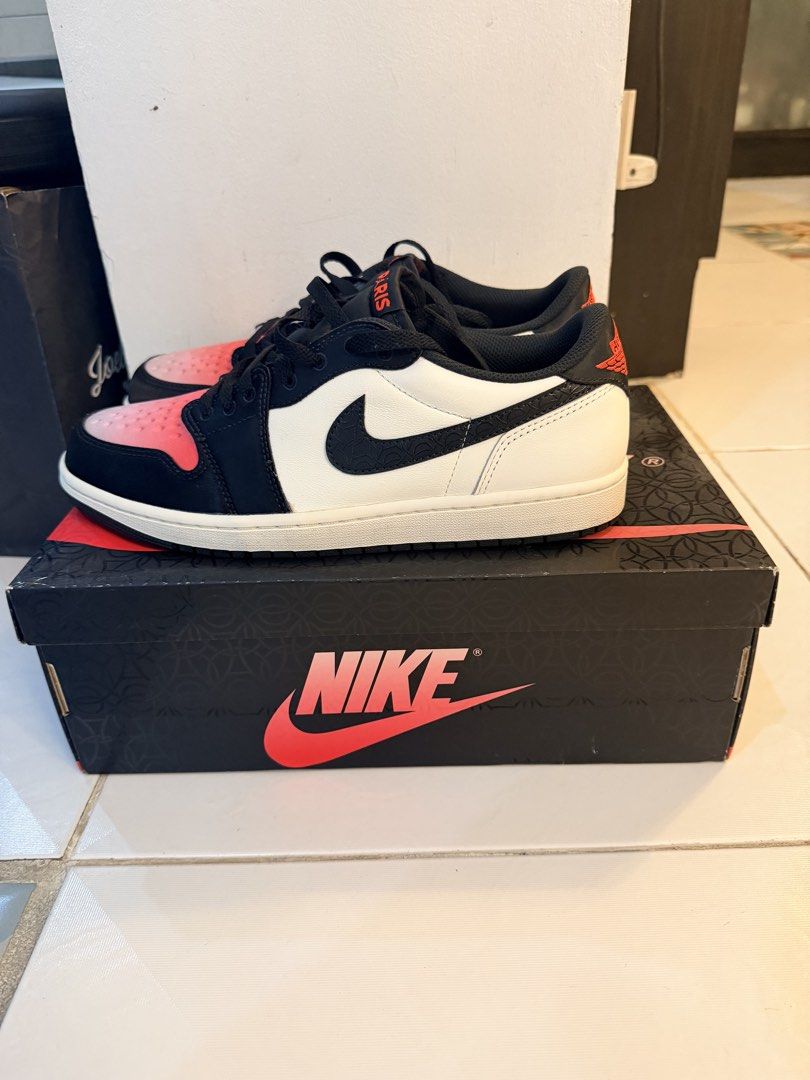 Air Jordan 1 Low OG PSG (Category: Sneakers) located in Quezon City. Submitted by ponchcan (Listing ID 1470834157, Image 1). Description: - Model: Air Jordan 1 Low Paris Edition - Condition: Brand new-like with zero wear, clean outsoles - Design: White leather upper, black overlays, and pink gradient toe box - Details: Paris branding on the tongue tag and custom insoles - Packaging: Includes original graphic shoebox - Trusted Carousell Seller: Bu