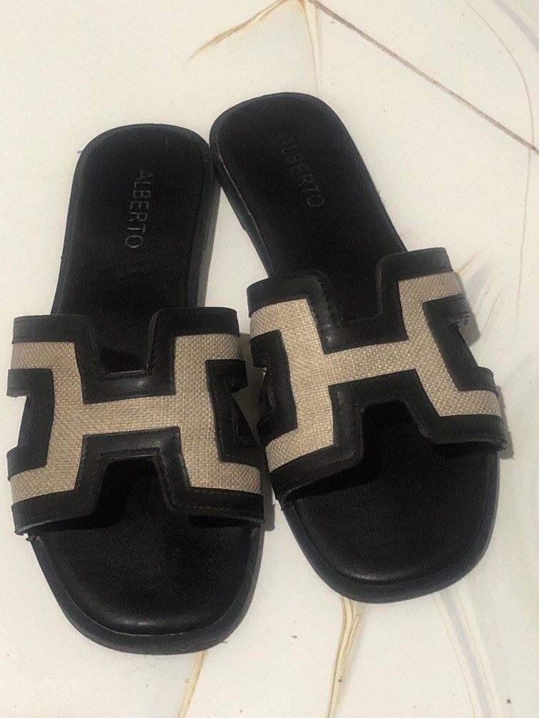 Alberto Handbag and Sandals Set Size 37 (Category: Flats & Sandals) located in Manila. Submitted by camron08 (Listing ID 1470879792, Image 3). Description: - Brand: Alberto matching set - Handbag: Structured cream handbag with cut-out pattern, twin zipper compartments, top handles, and metal hardware - Footwear: Black and beige slide sandals with geometric H-strap design, flat soles, and slip-on style (Size 37) - Inclusions: Original white Albert