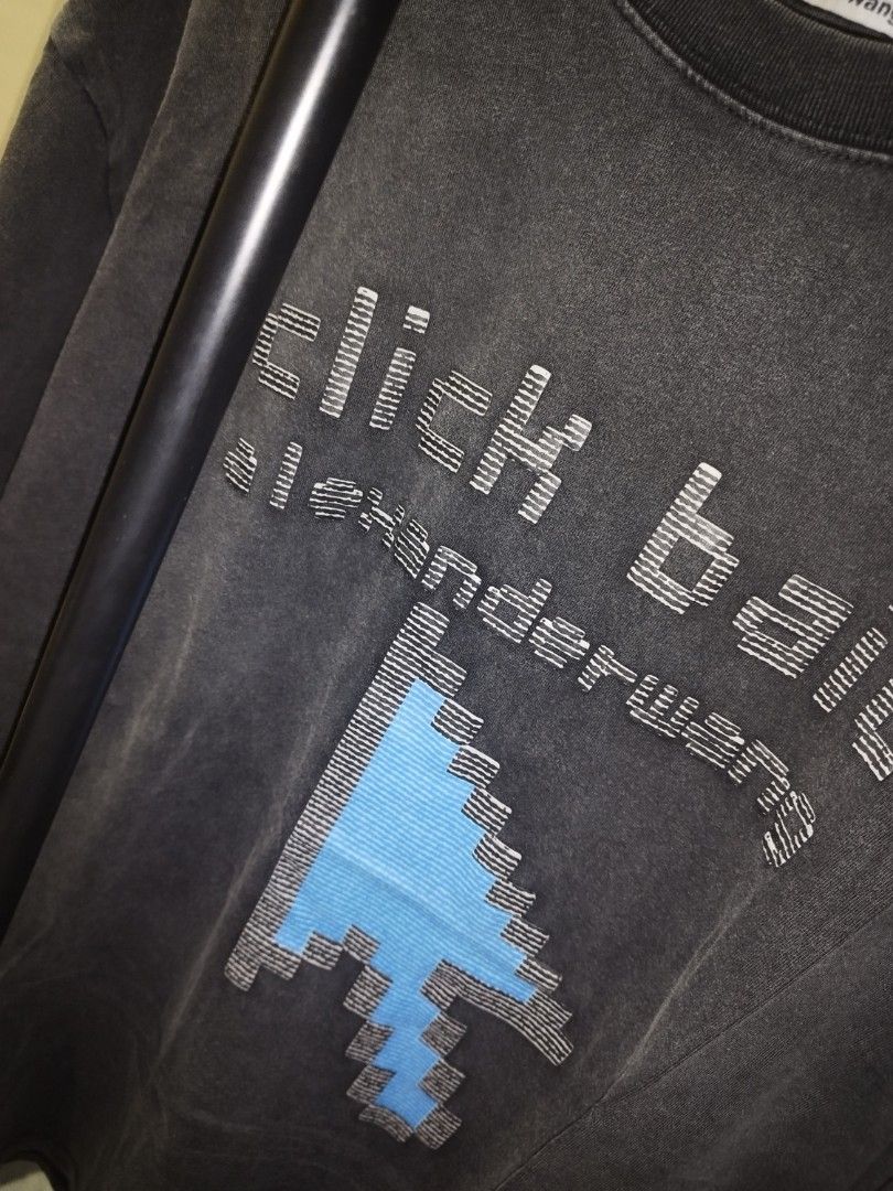 Alexander Wang Click Bait Graphic Tee (Category: Tshirts & Polo Shirts ) located in Tuguegarao City. Submitted by ZeevLim (Listing ID 1470926832, Image 2). Description: - Brand: Alexander Wang - Color: Dark Grey acid wash - Size: S 22w 28l - Material: 100% Cotton - Design: Pixelated blue mouse cursor graphic with 'click bait' text - Details: Crew neck, ribbed neckline, clean stitching throughout - Fit: Comfortable and easy to style for casual wea