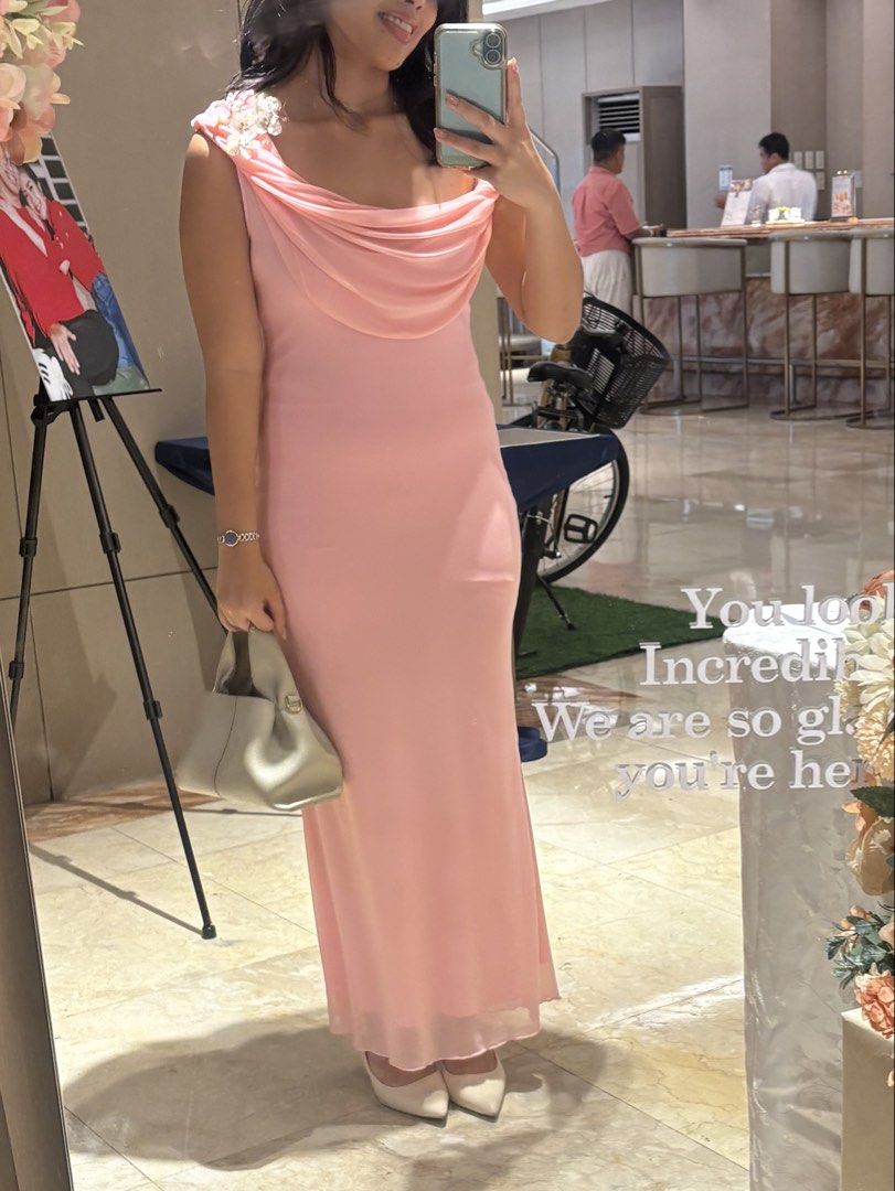Aloruh Solid Pleated Elegant Long Dress (Category: Dresses) located in Manila. Submitted by clarisseto33619 (Listing ID 1470895025, Image 3). Description: - Brand/Item: Aloruh long pink dress - Condition: Worn once for a few hours, super clean condition - Design: Elegant cowl neck with draped cape sleeves - Silhouette: Floor-length column cut - Color: Light pink solid fabric - Perfect for: Weddings, formal events, and parties.