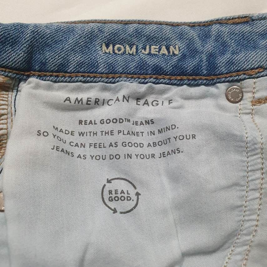 American Eagle Stretch Mom Jean (Category: Jeans) located in Caloocan City. Submitted by mma_222 (Listing ID 1470845525, Image 3). Description: - Brand: American Eagle (Real Good line) - Classic mom jean, high-waisted fit - Waist: 31 inches - Length [waist to hem]: 34 inches - Wash: Light wash denim with comfortable stretch - Details: Intentional distressing on the front and back pocket, standard belt loops, and leather brand patch on the back wa