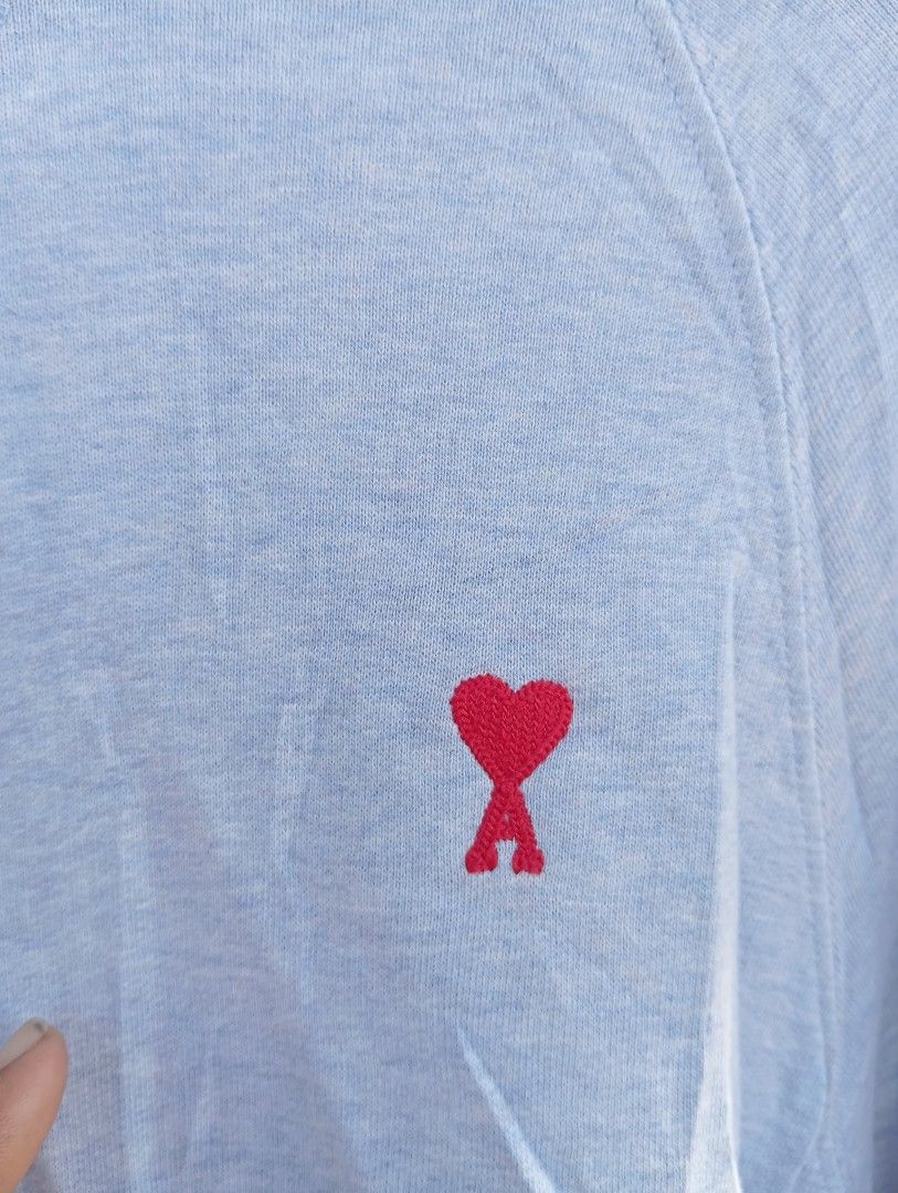 Ami Paris Light Blue Hoodie Size S (Category: Coats, Jackets and Outerwear) located in Manila. Submitted by jzk25 (Listing ID 1470747720, Image 2). Description: - Brand: Ami Paris - Item: Light blue hoodie - Size: Small (tag attached) - Details: Signature red embroidered heart logo on chest, front kangaroo pocket, ribbed cuffs and hem - Condition: Clean fabric inside and out, well-maintained - Shipping: Ships out fast from a trusted PH seller! Fe