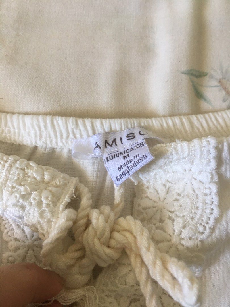 AMISU White Off-Shoulder Lace Blouse (Category: Blouses) located in Cabuyao City. Submitted by 4everblooms (Listing ID 1470773811, Image 2). Description: - Size: Medium (fabric is stretchable) - Material/Origin: Made in Bangladesh - Design: Off-shoulder with gathered elastic neckline and hem - Beach summer vibes.