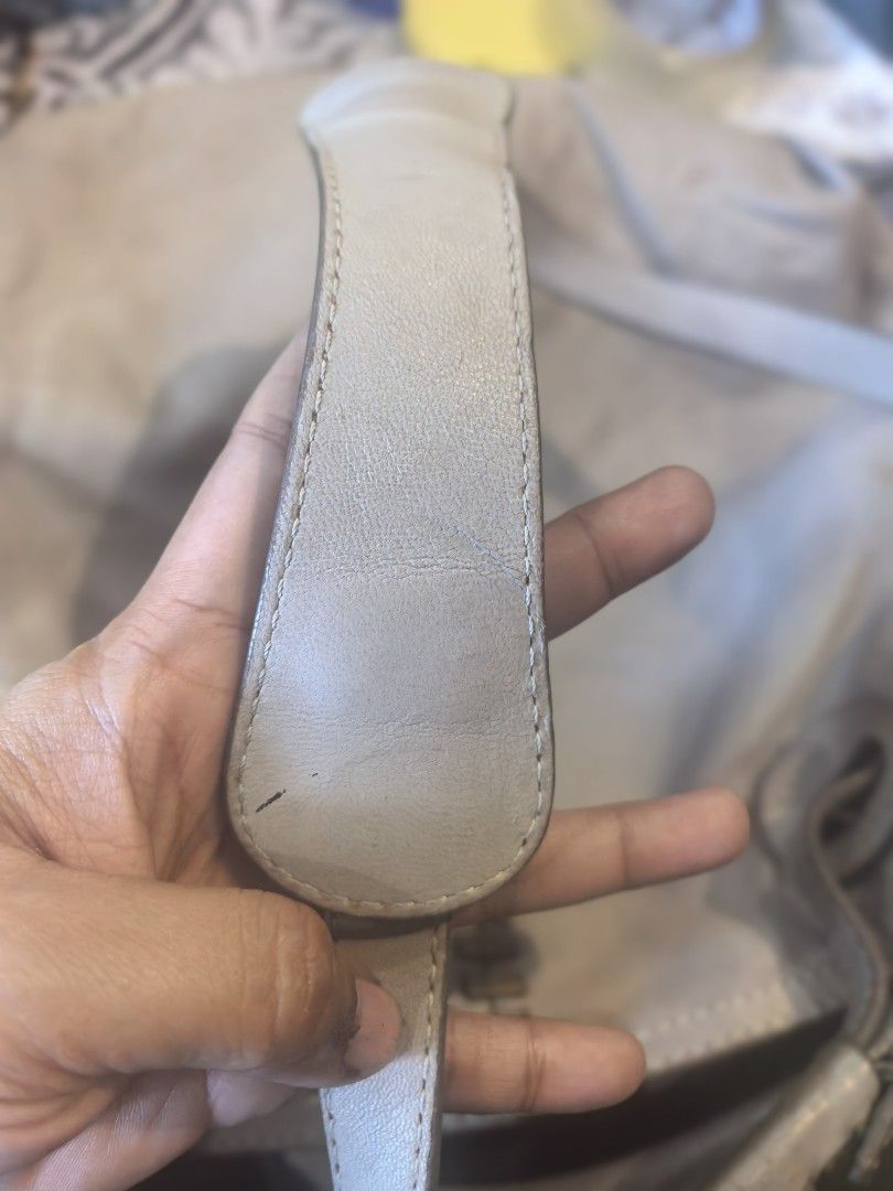 Andrea Mabiani Grey Leather Bag (Category: Luxury Bags & Wallets) located in Cagayan de Oro. Submitted by tommygurl1218 (Listing ID 1470800901, Image 3). Description: - Brand: Andrea Masiani - Style: Slouchy hobo shoulder bag - Color: Grey leather with gold-tone hardware - Design: Unique vertical whipstitch detail down the middle - Straps: Two comfortable woven shoulder straps - Interior: Spacious with a zip pocket and leather branding - Conditio
