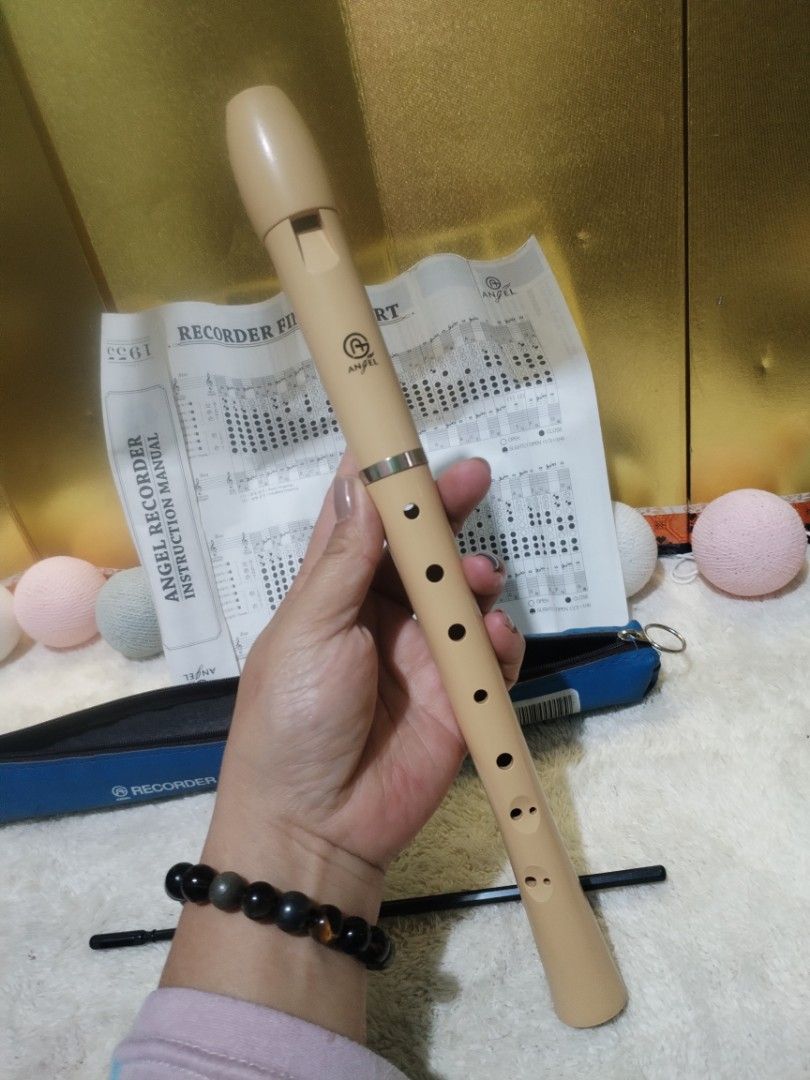Angel Soprano Recorder ASRB-351 with Case and Chart (Category: Musical Instruments) located in La Trinidad. Submitted by malditas (Listing ID 1470897966, Image 2). Description: - Model: Angel Soprano Recorder ASRB-351 - Color: Classic light beige, 3-piece standard plastic construction - Includes: Blue zippered storage case, cleaning rod, and mouthpiece cap - Extras: Original instruction manual featuring a complete finger chart - Perfect for: Musi