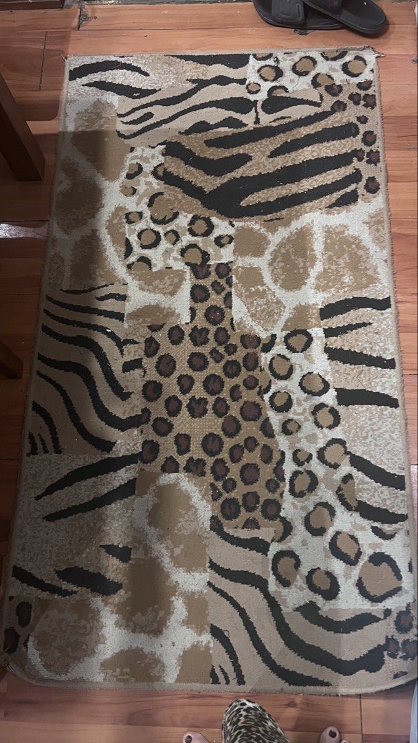 Animal print area rug leopard zebra giraffe pattern (Category: Carpets, Mats & Flooring) located in Pasig City. Submitted by zebteashoppe01 (Listing ID 1470853684, Image 2). Description: - Design: Mixed animal prints (leopard, zebra, and giraffe) - Colors: Stylish brown, black, and beige tones - Texture: Soft pile texture for comfort underfoot Size lenght 58 inches Width 31inches - Placement: Decent size, perfect for bedrooms or living rooms - Ca
