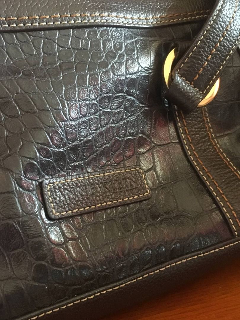 Anne Klein Y2K Handbag (Category: Luxury Bags & Wallets) located in Cavite. Submitted by xtina_m (Listing ID 1470771352, Image 2). Description: Anne Klein Y2K Handbag sourced from Instagram: - Material/Texture: Croc-embossed finish with contrast stitching - Straps: Dual shoulder straps with silver-tone rings - Closure: Secure top-zip closure - Interior: Fabric-lined. Spacious enough to fit medium-sized books. - Condition: Excellent body. Some pee